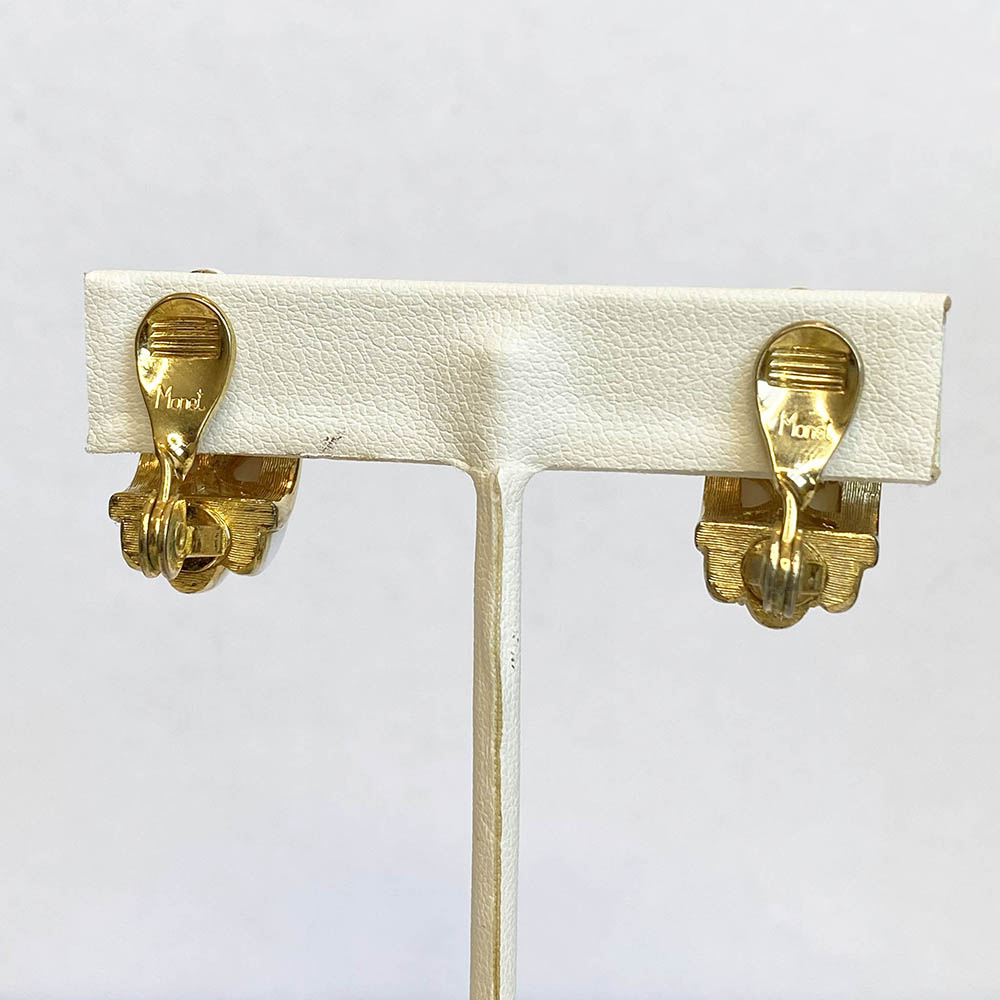 Vintage 1951 Monet Gold Tone White Ribbed Clip On Earrings